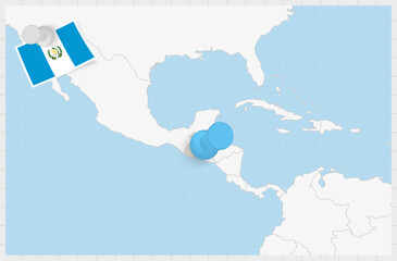 Map of Guatemala with a pinned blue pin. Pinned flag of Guatemala.