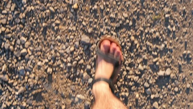 Caucasian Man Wearing Sport Leather Sandals Walking on Grass Field