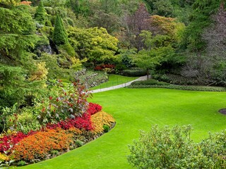 Flower bed with red, orange and yellow flowers