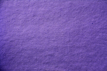 Old purple vintage paper background or texture