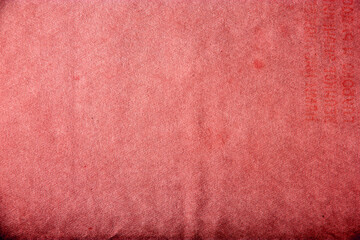 Old red vintage paper background or texture