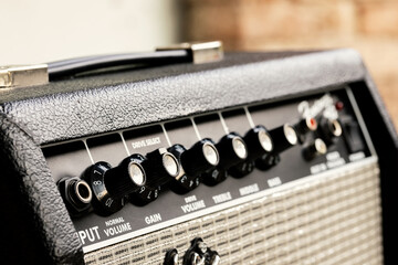 Close up on an amplifier, electronic amplifier or (informally) amp. Concept for music, volume, sound, soundcheck, transistor, electric guitar, noise, gain and concert.
