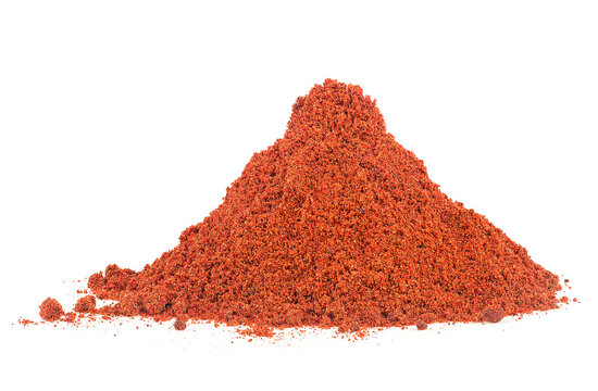Pile of red paprika powder isolated on a white background. Powdered dried red pepper.