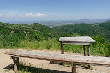 Landscape from Bulgaria with a bench and table in the foreground