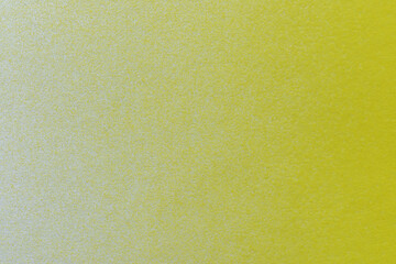 macro photography of yellow spray paint on white paper