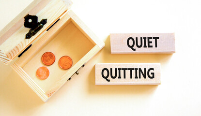 Quiet quitting symbol. Concept words Quiet quitting on wooden blocks. Beautiful white table white...
