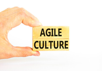 Agile culture symbol. Concept words Agile culture on wooden blocks. Beautiful white table white background. Businessman hand. Business flexible and agile culture concept. Copy space.