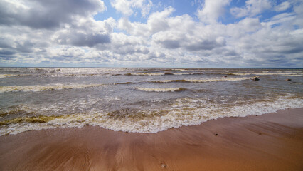 Wide angle HDR view of the sea and cloudy sky