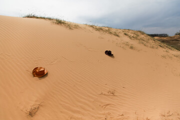 Cowboy hats on the sand in the arid desert.