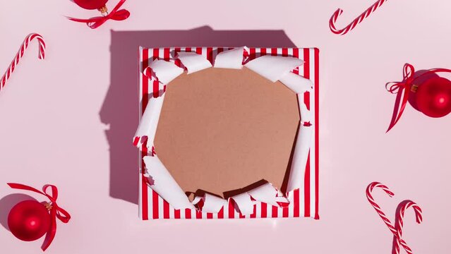 Unwrapping gift revealing space for text. Stop Motion Animation. Mockup for discounts, text etc