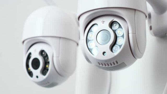 Small IP camera turns observing area in office room closeup. Recording video to secure property and people. Online translation of events closeup