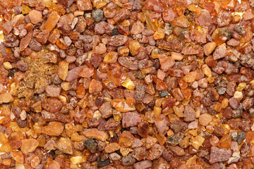 Close-up of Amber (Succinite), a fossilized fossil tree resin, appreciated since prehistoric times as jewelry and for art objects but also used as incense and natural medicine