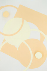 Abstract background with 3D paper elements in beige, orange colors resembles female forms - chest, abdomen. Backdrop advertising products, copy space