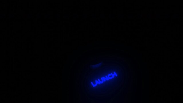 Glowing 3d launch button. Design. Button to start computer system in dark. Neon startup sign with computer system button