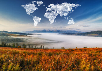 Fototapeta na wymiar clouds in the form of a map of the world over the mountains. autumn dawn in the Carpathians. Travel and landscape concept 