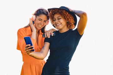 two girls with mobile phone and headphones