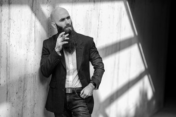 Elegant bearded man with cigar.