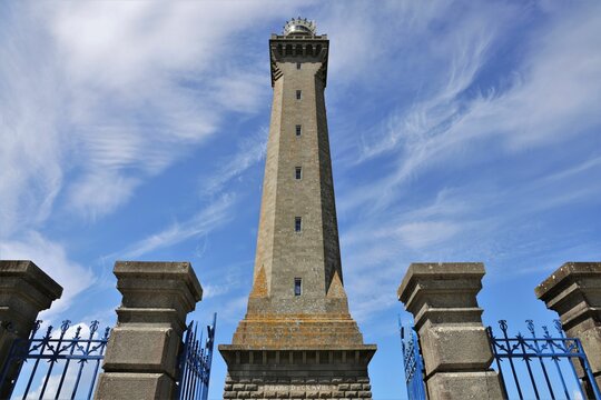 Closeup shot of the lighthouse of Eckmuhl against a blue sky in Penmarch, Brittany, France