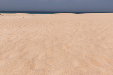 Fototapeta na wymiar beach sand dunes near the sea. sand backgrounds and textures