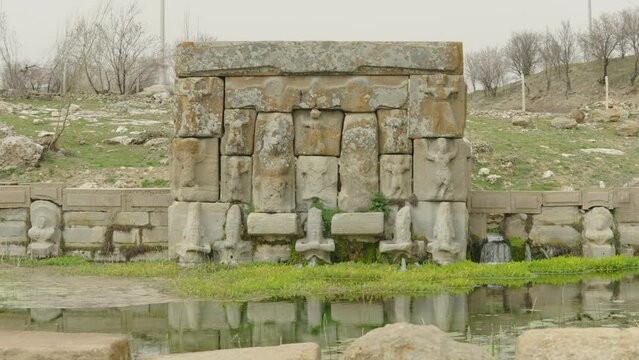 Eflatun Pinar ( Eflatunpinar) Ancient Hittite relief sculpture monument and sacred pool, and its Hittite relief scultures of Hittite gods
