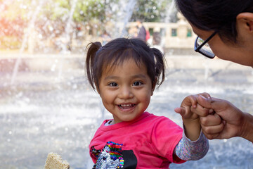 beautiful and tender mexican indigenous girl smiling happily at the camera. Hispanic