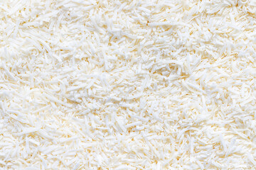 Coconut flakes background. Top view of shredded dry fruit