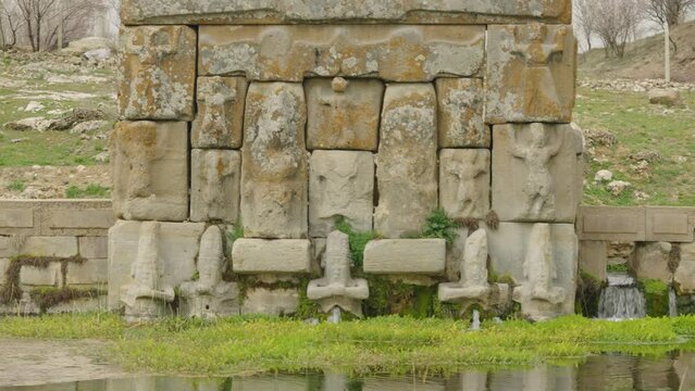 Eflatun Pinar ( Eflatunpinar) Ancient Hittite relief sculpture monument and sacred pool, and its Hittite relief scultures of Hittite gods
