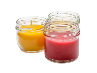 a set of multicolored scented candles in transparent jars on a white background