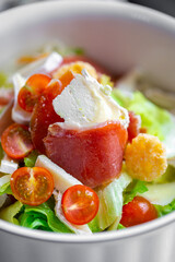 Summer salad. Fresh salad with mozzarella. Lettuce with cherry tomatoes, cucumbers and mozzarella. Bebe mozzarella. Diet salad. Vegetarian salad