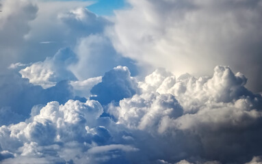 Naklejka na ściany i meble Clouds background seen from an airplane
