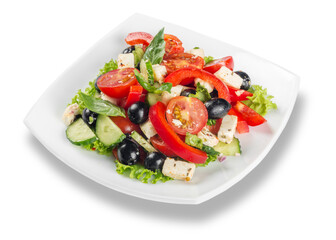 Greek salad with fresh vegetables on white background