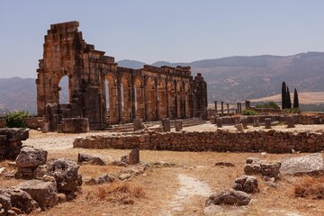 Structure built in Volubilis city under clear blue sky in Morocco.
