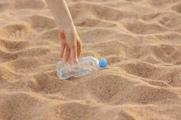 plastic garbage on the beach, environmental pollution. climate change and global warming. volunteers collect plastic bottles. recycling, products without eco trace. taking care of the environment
