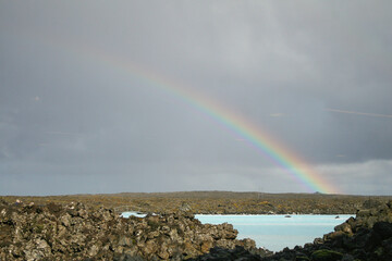 A rainbow over the waters of the Blue Lagoon , a geothermal spa in Iceland. Image has copy space.