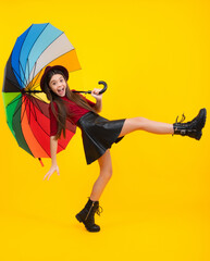 Child wuth umbrella under rain. Rainy weather, seasonal autumn. Excited teenager, glad amazed and...