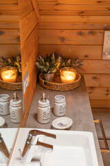 Cozy bathroom interior with soap dispenser and decorative elements