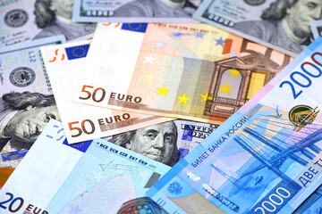 US dollars, Russian rubles and Euro banknotes. American and european economic, sanctions against Russia, exchange rate