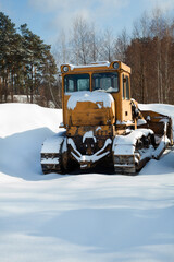 Bulldozer on the snow in winter.