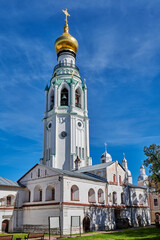 Fototapeta na wymiar Russia. City of Vologda. Kremlin. The bell tower of St. Sophia Cathedral behind the economic building