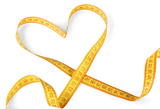 Yellow measuring tape in heart shape isolated on white background