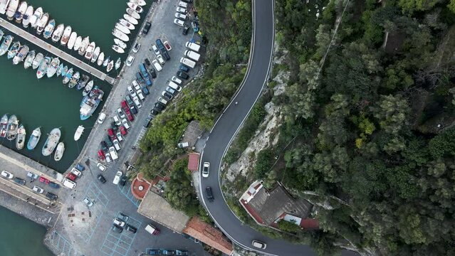 Aerial view of vehicles driving on the road in Cetara Amalfi Coast, Salerno, Campania, Italy.