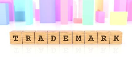 Word with the text TRADEMARK chiselled on wooden blocks reflected on the white table. Business concept. In the back are colorful cuboids in different shapes. (3D rendering)