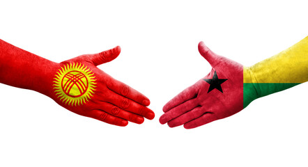 Handshake between Guinea Bissau and Kyrgyzstan flags painted on hands, isolated transparent image.