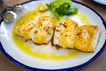 Grilled fillet of white codfish served in fish restaurant in San Sebastian, Basque Country, Spain