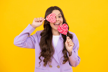 Hipster teenager child girl lick lollypop. Sugar nutrition, candy and sweets. Child eat lollipop...