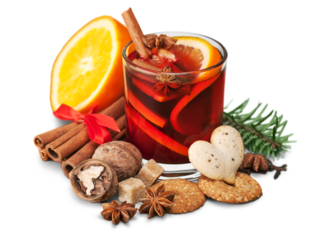 Glass with Hot red mulled wine for winter and Christmas with orange slice, anise and cinnamon sticks isolated on white background