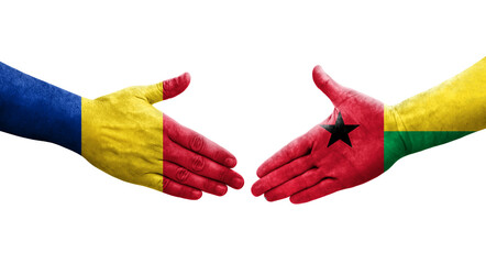 Handshake between Guinea Bissau and Romania flags painted on hands, isolated transparent image.