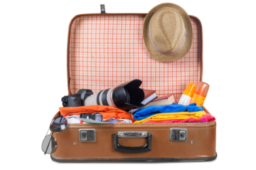 Suitcase with clothes and other travel accessories