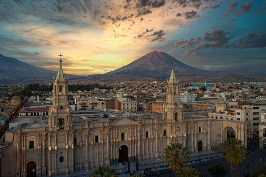 Aerial view of the Plaza de Armas with the Arequipa Cathedral and the Misti Volcano in the background in Arequipa, Peru at the blue hour/sunset.