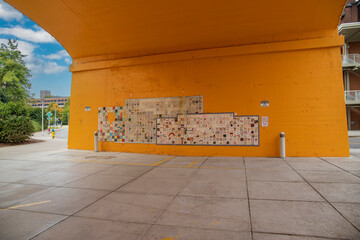 a tile wall mural against and orange wall at Knoxville Remembers Graffiti in Knoxville Tennessee USA - obrazy, fototapety, plakaty